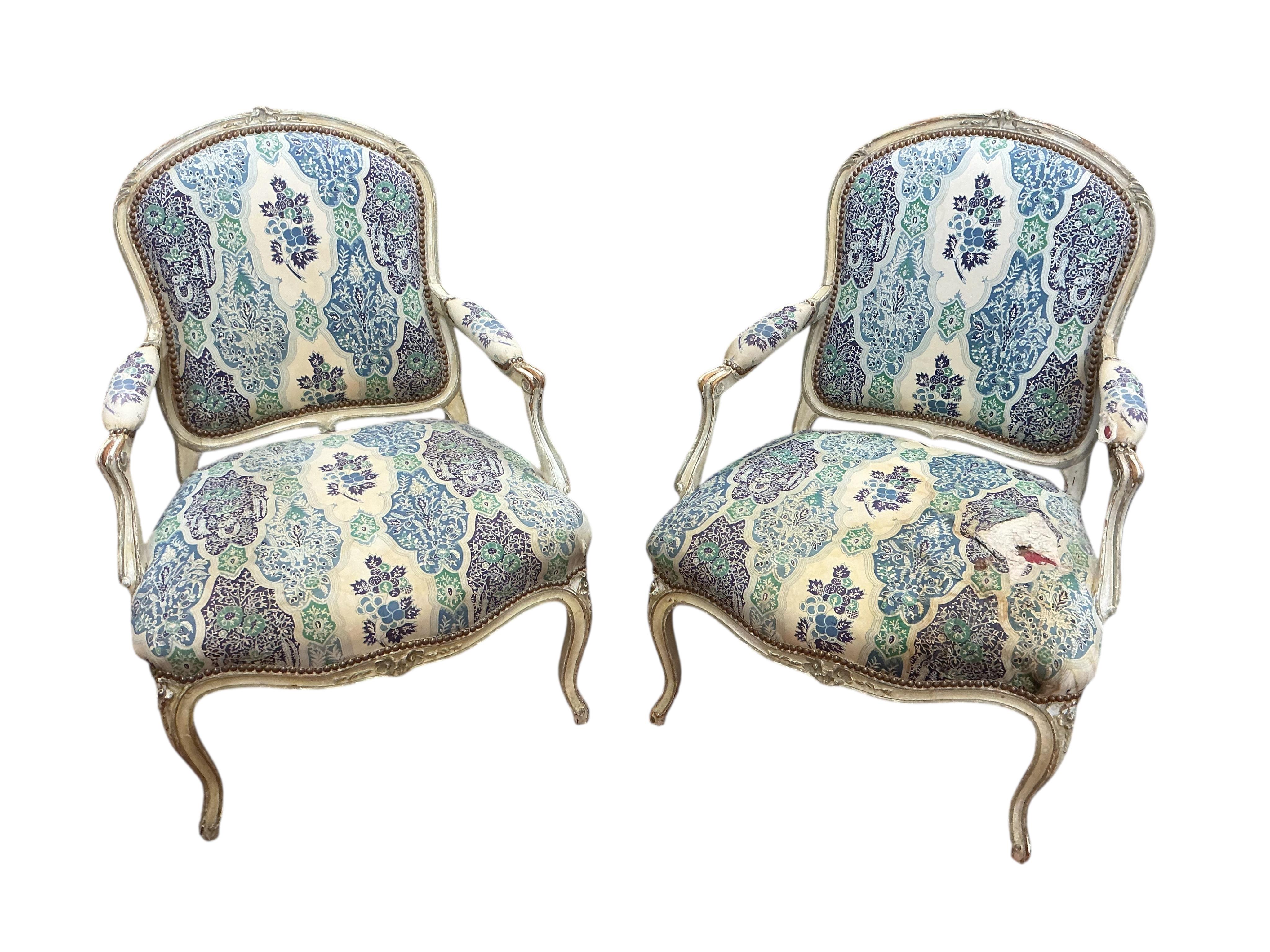 A pair of French elbow chairs, width 63cm, depth 58cm, height 94cm